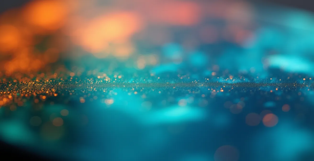 Vue macro détaillée d'un écran mobile montrant des éléments visuels colorés d'une interface d'application